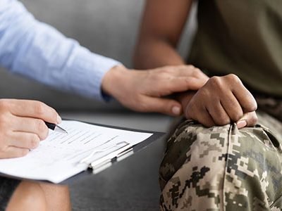 Psychotherapist supporting soldier